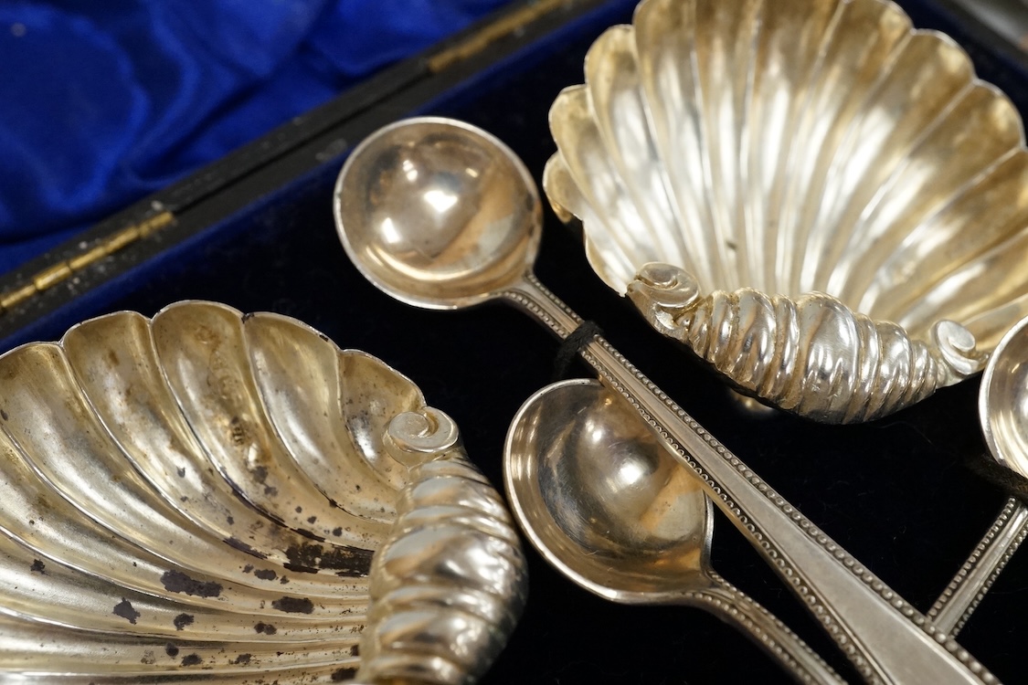 A group of small silver to include a cased modern silver butter shell and knife by Francis Howard Ltd, Sheffield, 1988, a cased set of four late Victorian silver shell salts with four associated plated spoons, a late 196